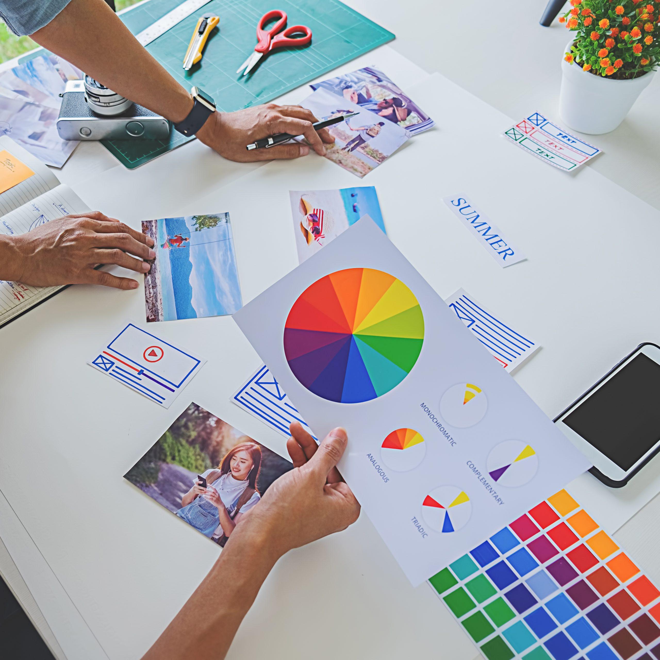 Asian advertising designer creative start-up team discussing ide