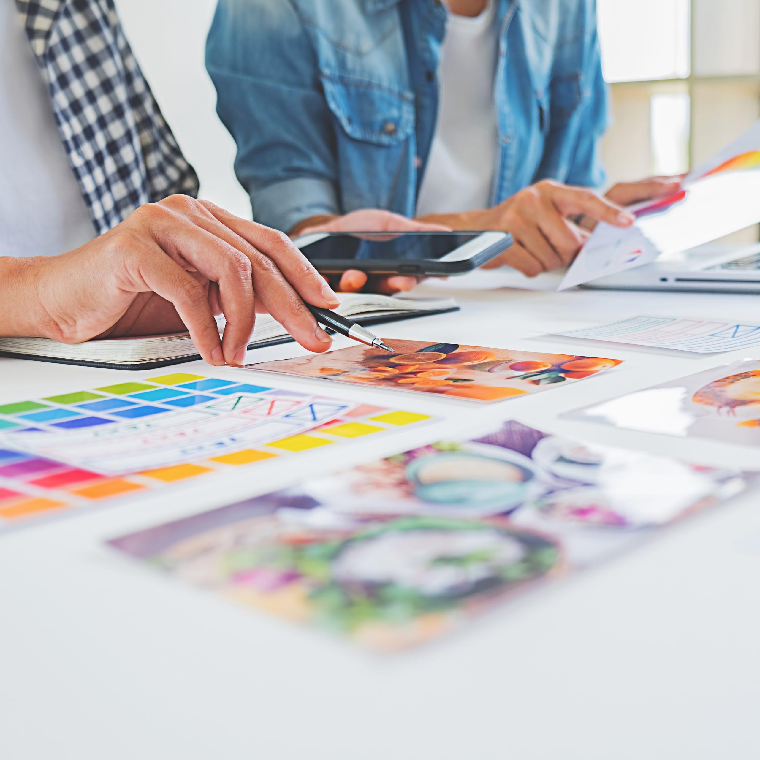 Asian advertising designer creative start-up team discussing ide